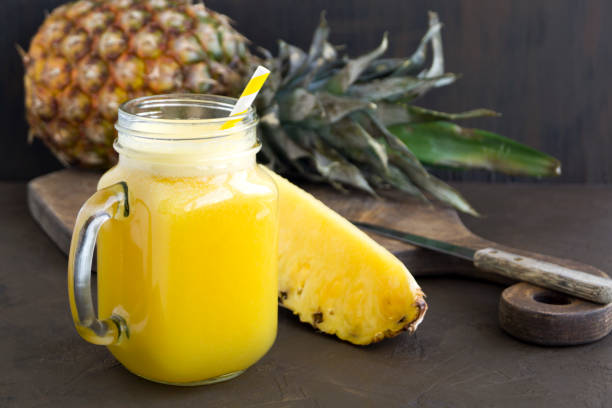 istock Pineapple juice in a jar with a straw. 1143321299