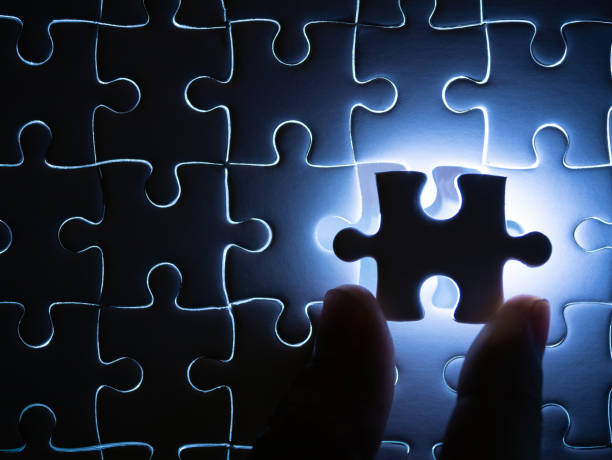 istock Missing Jigsaw puzzle piece with lighting, Business concept for completing the finishing puzzle piece. 1143321440
