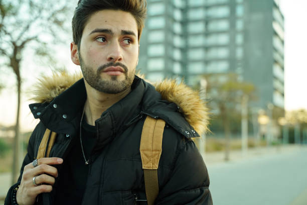 istock Cool young man at sunset in the city 1143322602