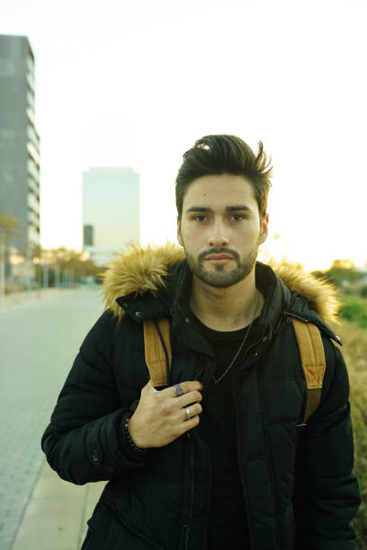 istock Cool young man at sunset in the city 1143322728