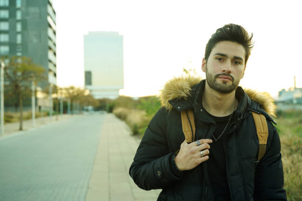 istock Cool young man at sunset in the city 1143322922
