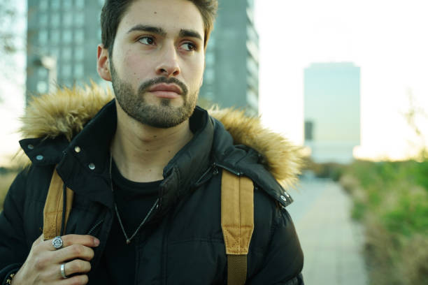 istock Cool young man at sunset in the city 1143322960