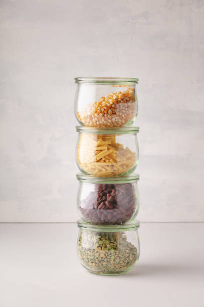 glass jars with pasta, lentils, beans and corn - 5891 imagens e fotografias de stock