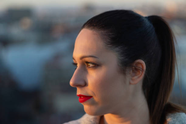 istock Young Woman enjoying the sunset 1143324068