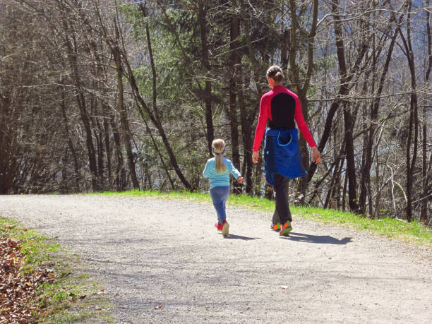 istock Mother with kids hiking in forest 1143326132