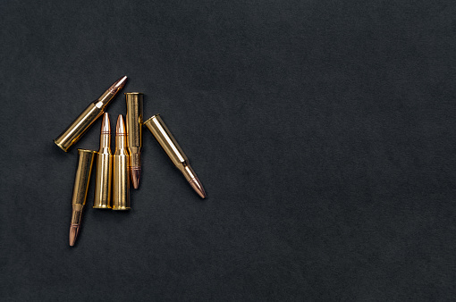 Rifle cartridges on a black background