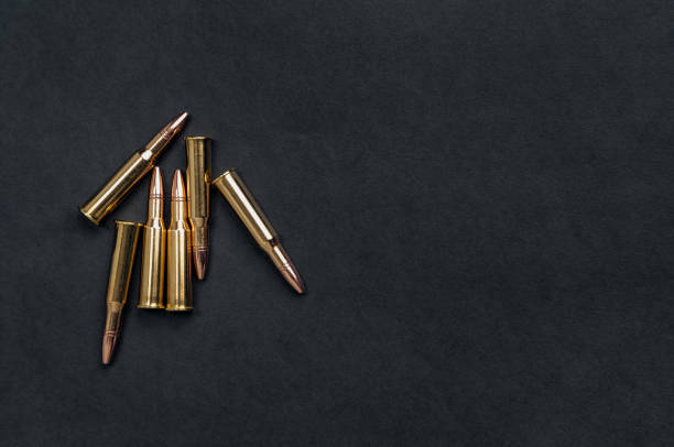 rifle cartridges on a black background - full metal jacket imagens e fotografias de stock