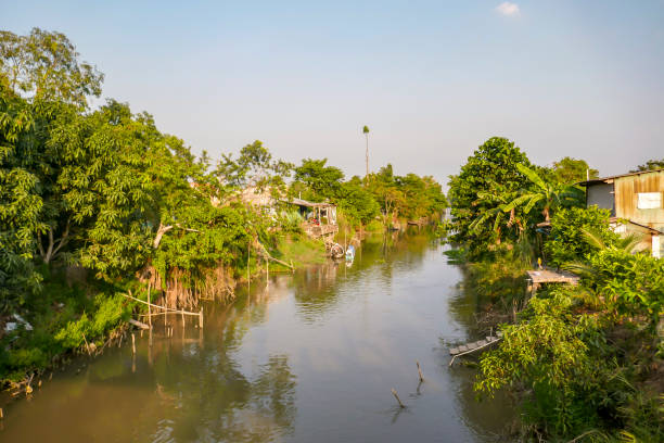 istock Village on channel waterfront in Mekong Delta 1143335945