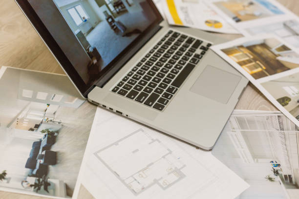 istock Construction equipment. Repair work. Drawings for building Architectural project, blueprint rolls and laptop tablet pancil and divider compass on table. Engineering tools concept. Copy space. 1143338821