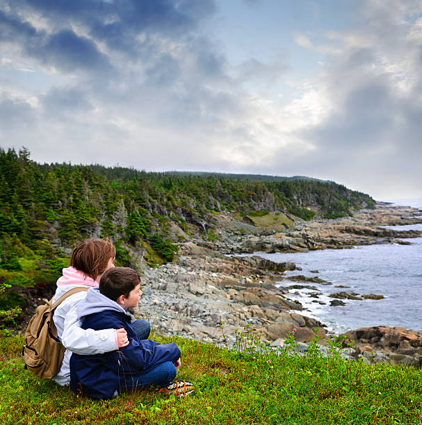 istock Children sitting at Atlantic coast in Newfoundland 114333982