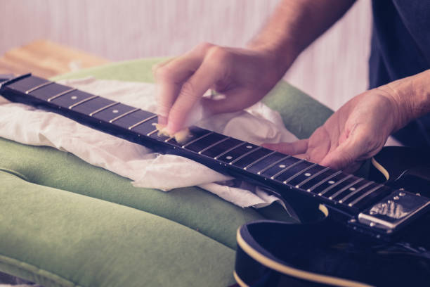 istock Guitar maintenance, oiling fretboard, close-up 1143341844