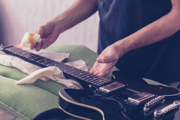 istock Guitar maintenance, oiling fretboard, close-up 1143341882