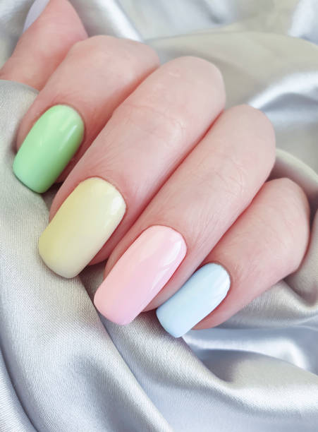 istock female hand, beautiful manicure, silk 1143342413