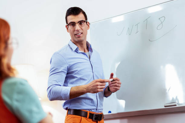 istock Smart intelligent teacher looking at his student 1143343967