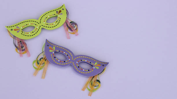 istock Masquerade masks on a purple background 1143346437
