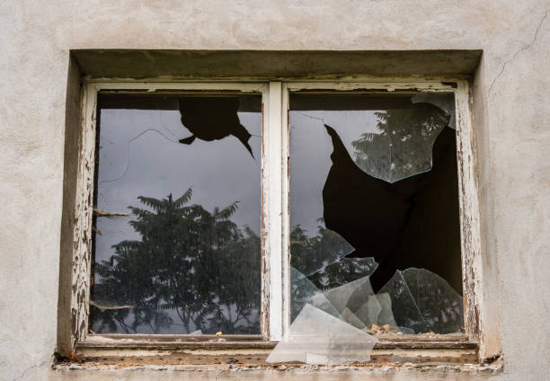 istock Burglary with broken window pane 1143346492
