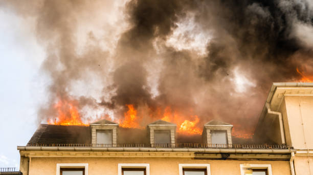 istock Close view of flames in an upper story window 1143346624
