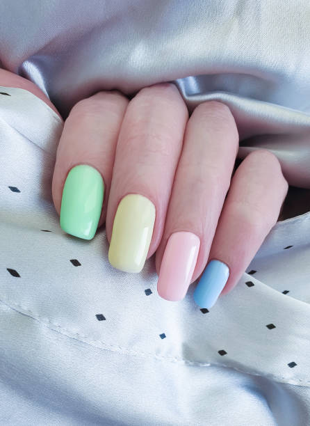istock female hand, beautiful manicure, silk 1143350155