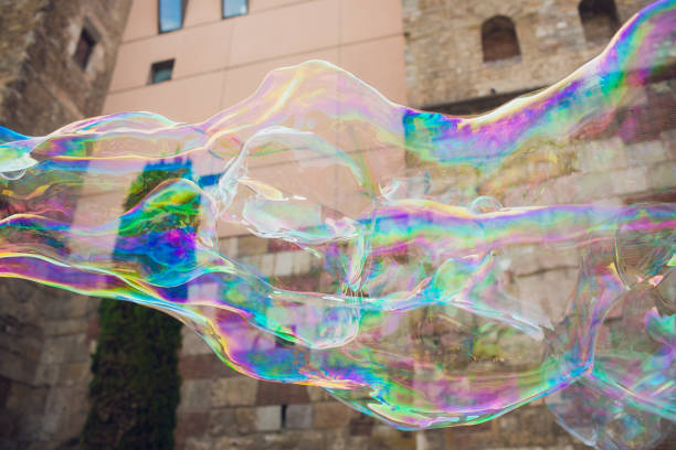 istock Soap bubbles against the city hall. Barselona. 1143350288