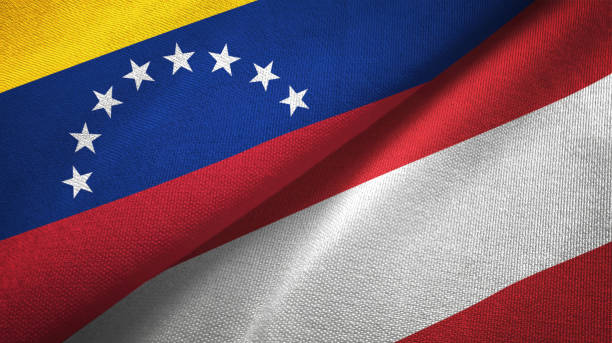 istock Venezuela and Austria two flags textile cloth, fabric texture 1143353891