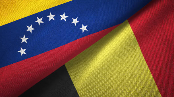 istock Venezuela and Belgium two flags textile cloth, fabric texture 1143353970