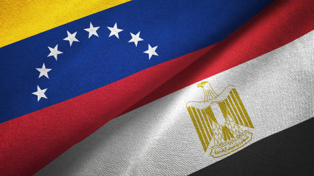 istock Venezuela and Egypt two flags textile cloth 1143354012