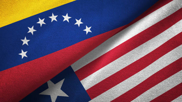 istock Venezuela and Liberia two flags textile cloth, fabric texture 1143354088