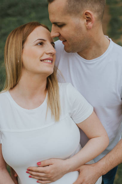 istock Young loving couple showing their affection in the nature. 1143354189