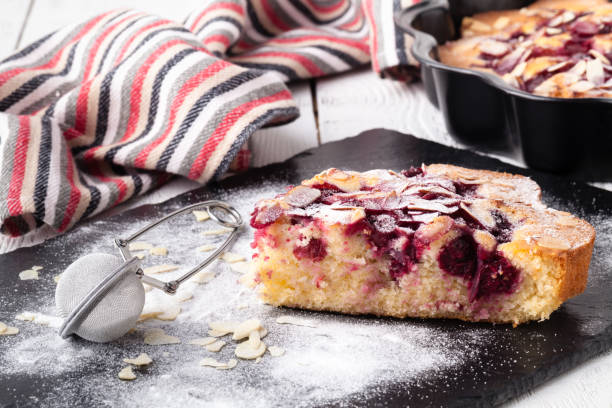 istock Breakfast concept, Homemade slice of shortbread dough raspberry pie with almond petals 1143354882