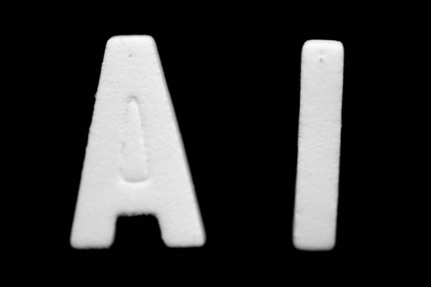 istock White letters A and I on black background 1143355382