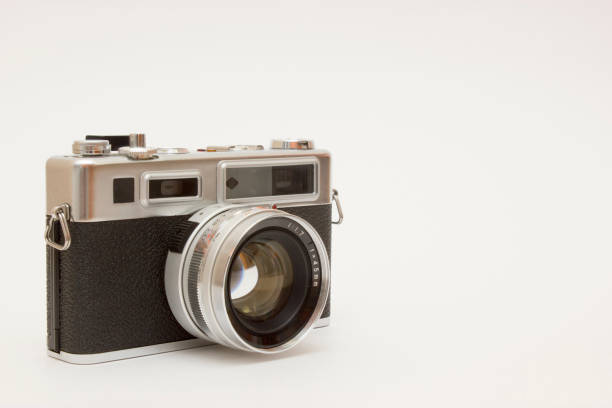 istock Old film camera on white backround 1143355723