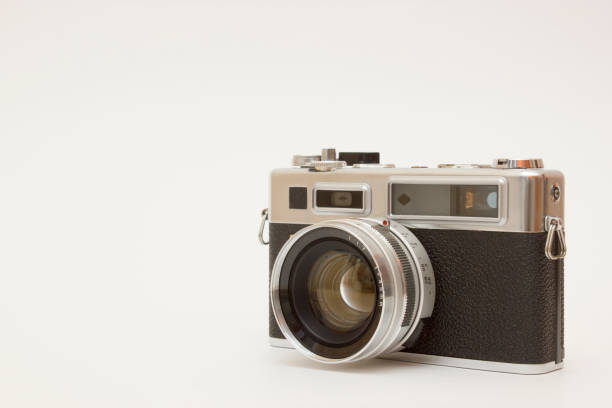 istock Old film camera on white backround 1143355726