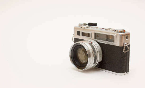 istock Old film camera on white backround 1143355730