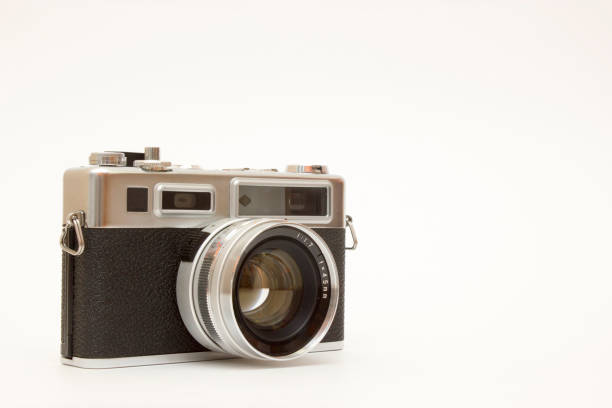istock Old film camera on white backround 1143355753