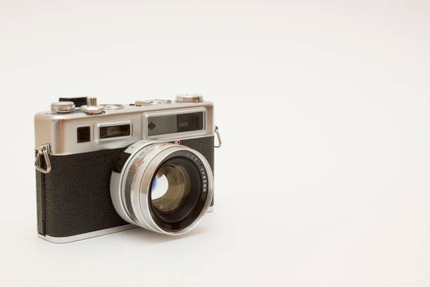 istock Old film camera on white backround 1143355758