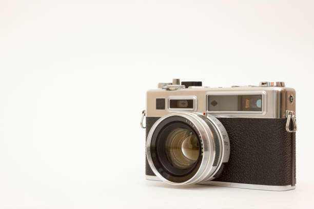 istock Old film camera on white backround 1143355761