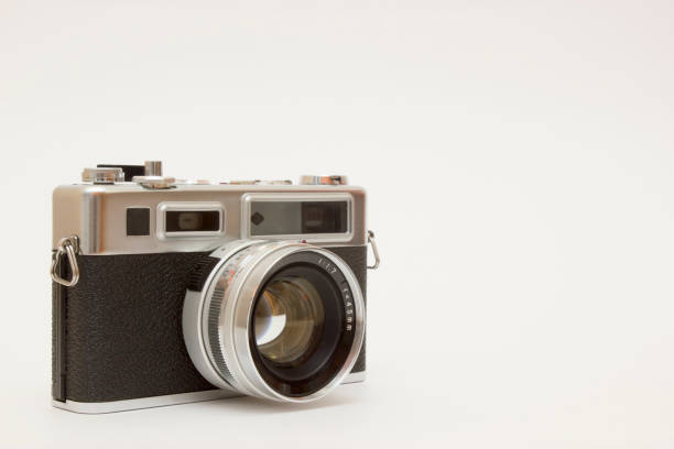 istock Old film camera on white backround 1143355765