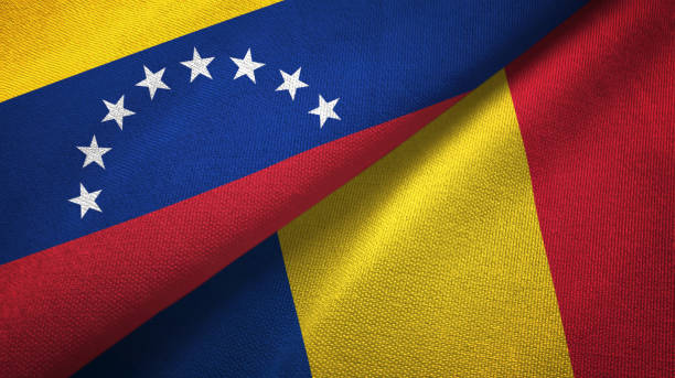 istock Venezuela and Romania two flags textile cloth, fabric texture 1143356282