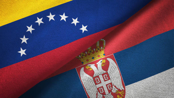 istock Venezuela and Serbia two flags textile cloth, fabric texture 1143356327
