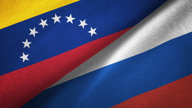 istock Venezuela and Russia two flags textile cloth, fabric texture 1143356336