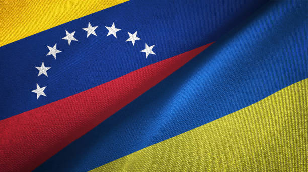 istock Venezuela and Ukraine two flags textile cloth, fabric texture 1143356894