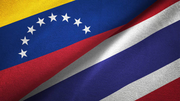 istock Venezuela and Thailand two flags textile cloth, fabric texture 1143357398