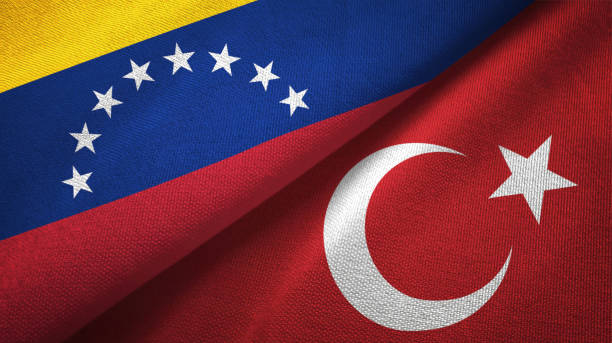 istock Venezuela and Turkey two flags textile cloth, fabric texture 1143357399