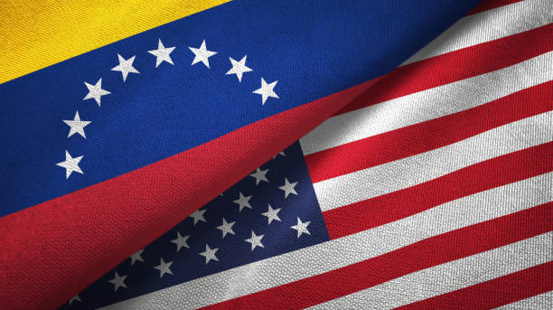 istock Venezuela and United States two flags textile cloth, fabric texture 1143357415