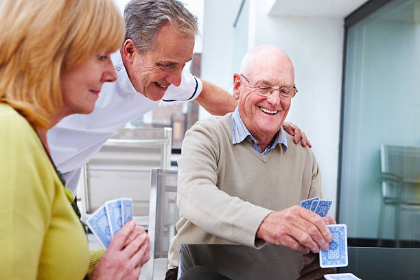 istock Elderly Couple Playing Cards 114335796