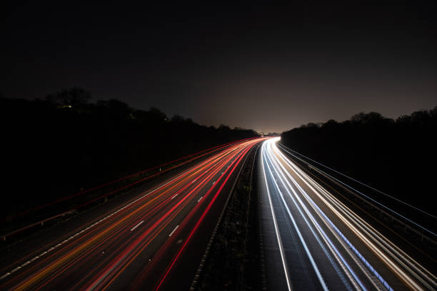 istock Headlights and Taillights on Motorway at Night in UK 1143358084