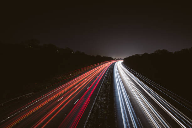 istock Headlights and Taillights on Motorway at Night in UK 1143358173