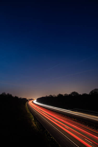 istock Headlights and Taillights on Motorway at Night in UK 1143358268