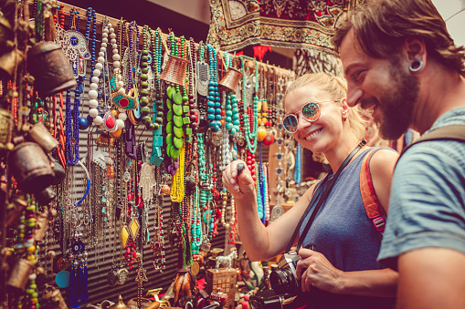 Man and woman discover gifts market while travelling Middle East