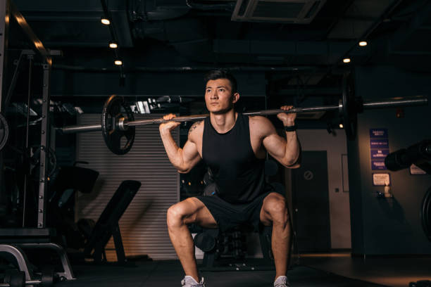 istock Young Asian bodybuilder lifting barbell 1143359698